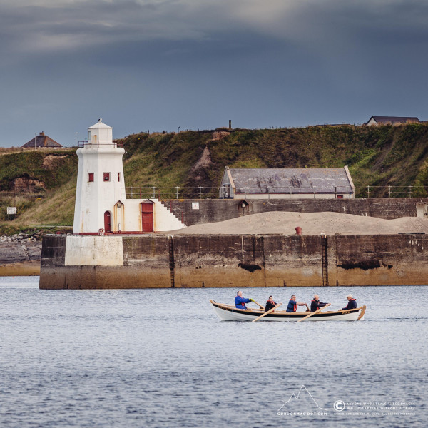 Wick Coastal Rowing Club heading out past the South Pier, Wick