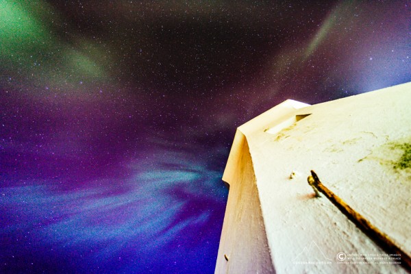 At the end of the pier watching the aurora.